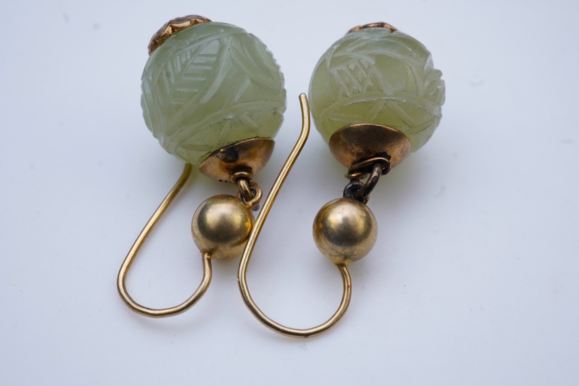 A chatelaine and a pair of serpentine bead earrings